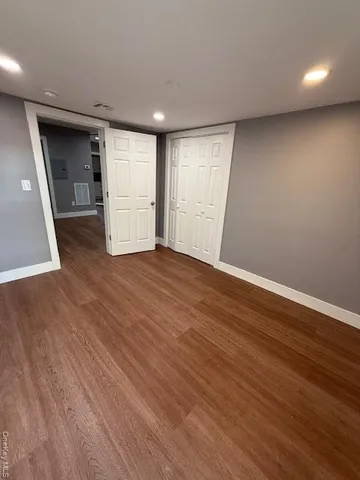 a bathroom with a toilet sink shower and mirror