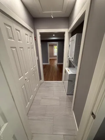 a view of a backyard with a garden and tree