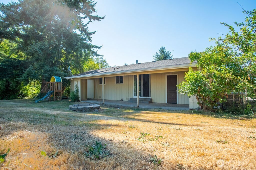 651 Jorgensen Road Onalaska, WA 98570 - Photo 15 of 36 a view of a house with a yard and large tree