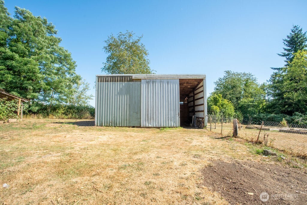 651 Jorgensen Road Onalaska, WA 98570 - Photo 18 of 36 a view of a house with a yard and garage
