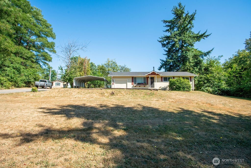 651 Jorgensen Road Onalaska, WA 98570 - Photo 29 of 36 a view of house with outdoor space and trees in the background