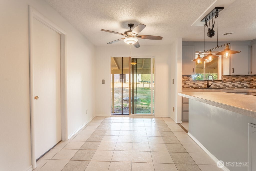 651 Jorgensen Road Onalaska, WA 98570 - Photo 4 of 36 a view of a kitchen with a sink and cabinet