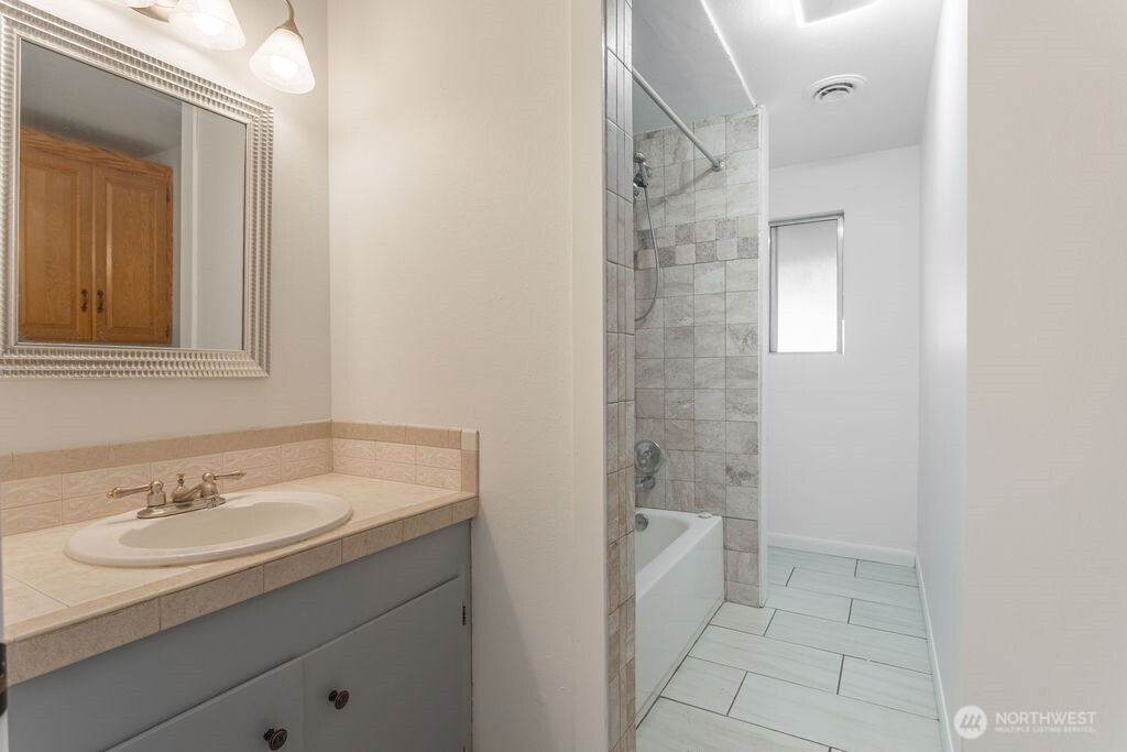 651 Jorgensen Road Onalaska, WA 98570 - Photo 8 of 36 a bathroom with a granite countertop sink a toilet and shower