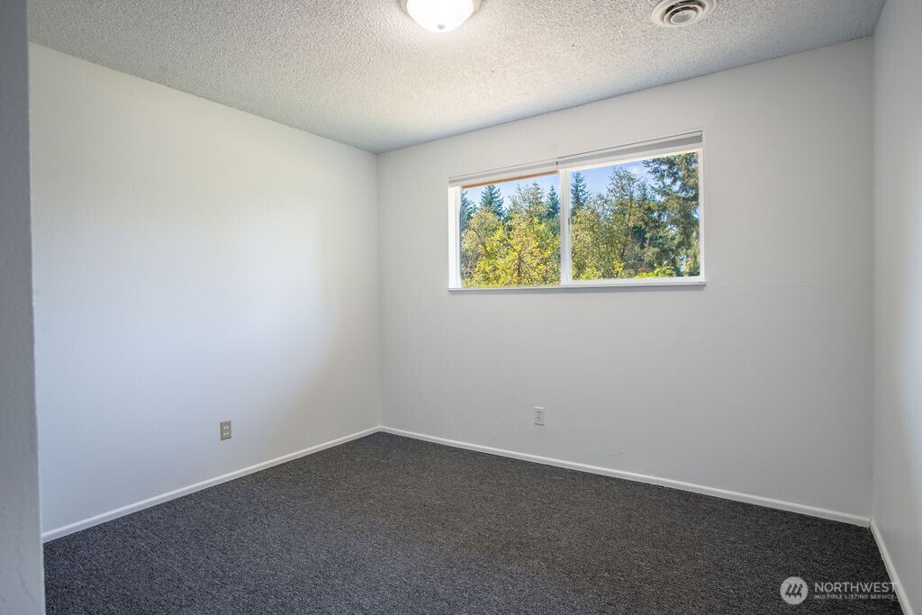 651 Jorgensen Road Onalaska, WA 98570 - Photo 10 of 36 an empty room with a window