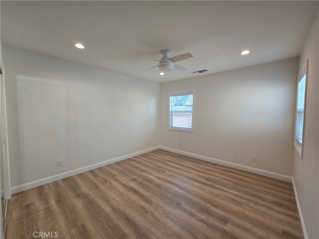 119 Norumbega Drive, Unit 1 Monrovia, CA 91016 - Photo 11 of 14 an empty room with a window and a ceiling fan