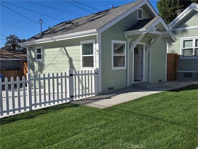 a front view of a house having yard