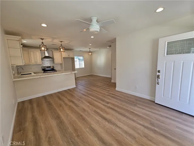 a view of a kitchen with a sink and cabinet