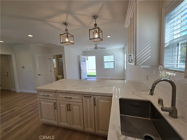 a kitchen with a sink and cabinets