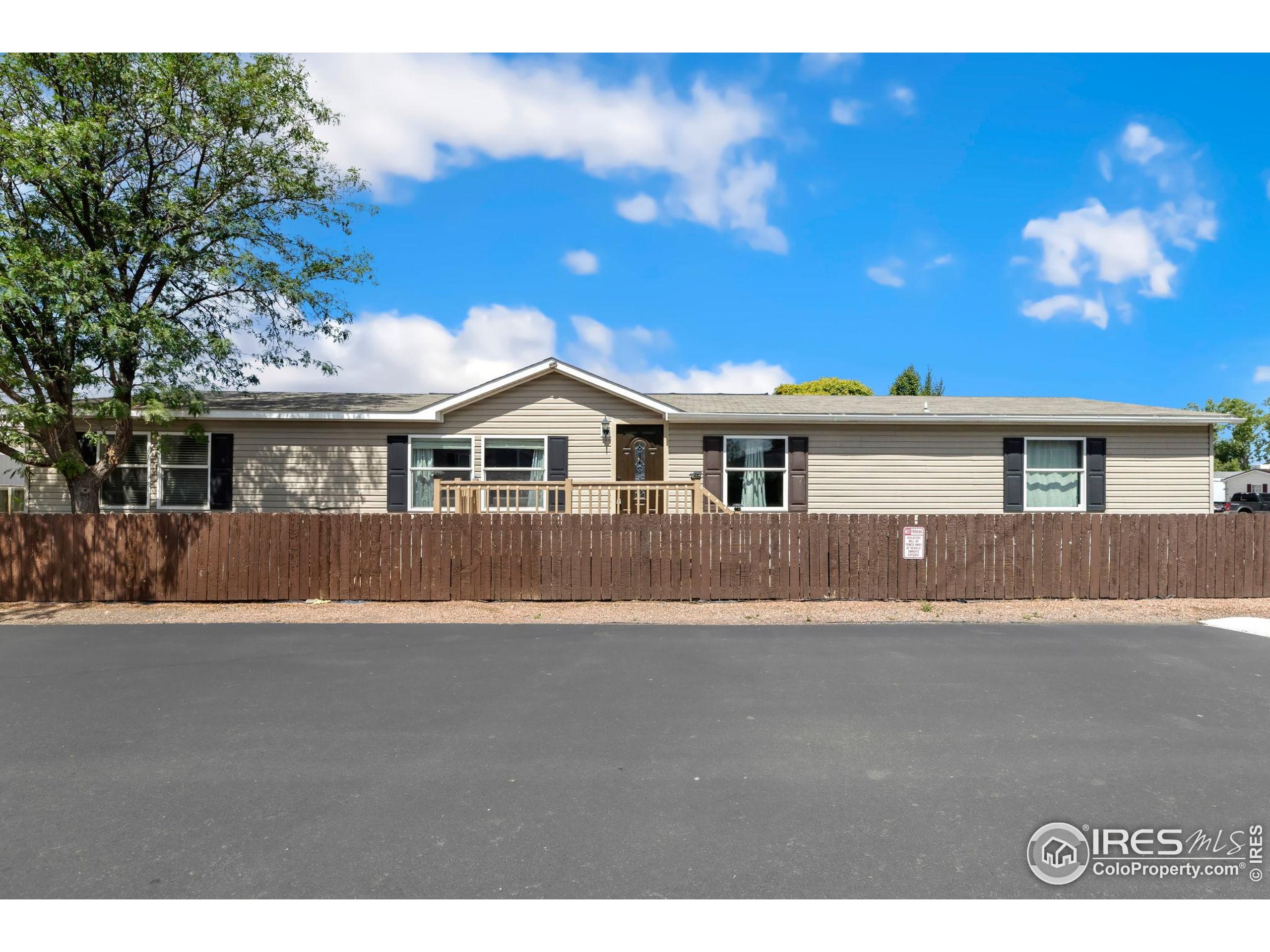 218 Grape Street, Unit 29 Hudson, CO 80642 - Photo 5 of 26 a view of house with yard