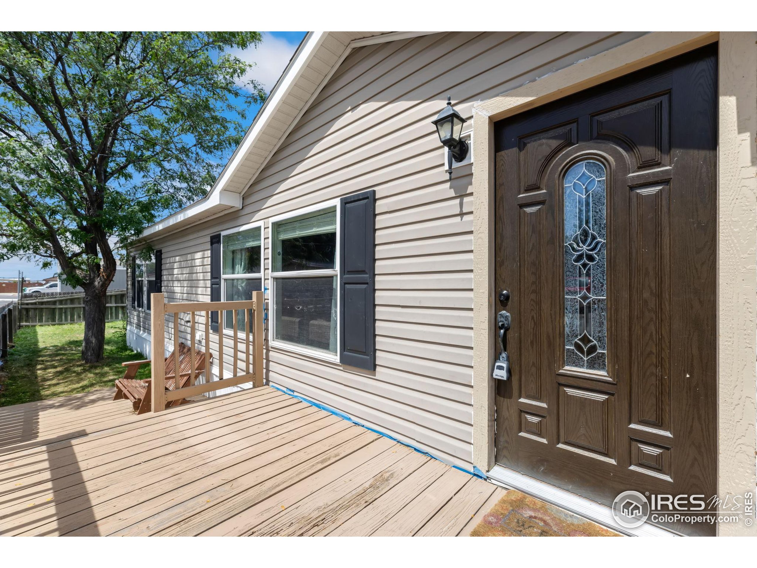 218 Grape Street, Unit 29 Hudson, CO 80642 - Photo 6 of 26 a front view of a house with a porch