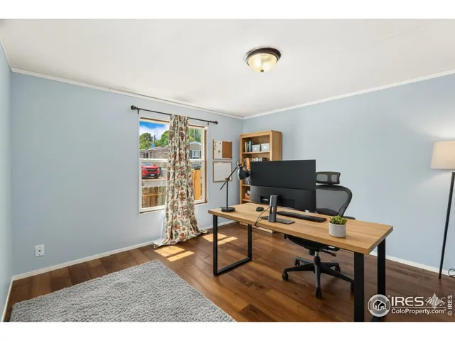 a workspace with furniture and a window