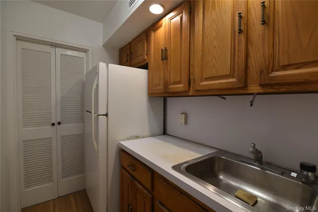 a kitchen with a sink and cabinets