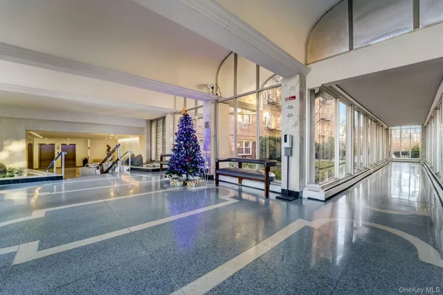 a view of a hallway with seating area