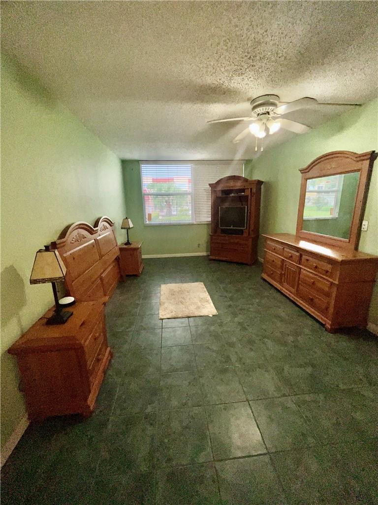 Undisclosed Address Margate, FL 33063 - Photo 13 of 15 a living room with furniture and a rug