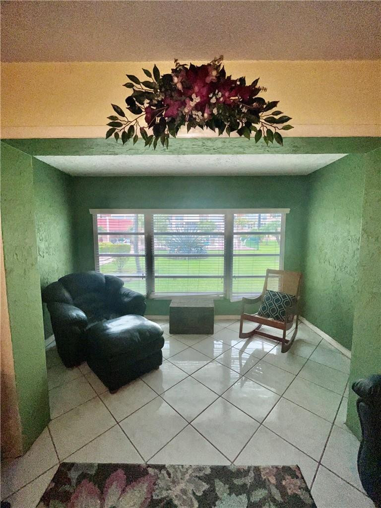 Undisclosed Address Margate, FL 33063 - Photo 8 of 15 a living room with furniture and a wooden floor