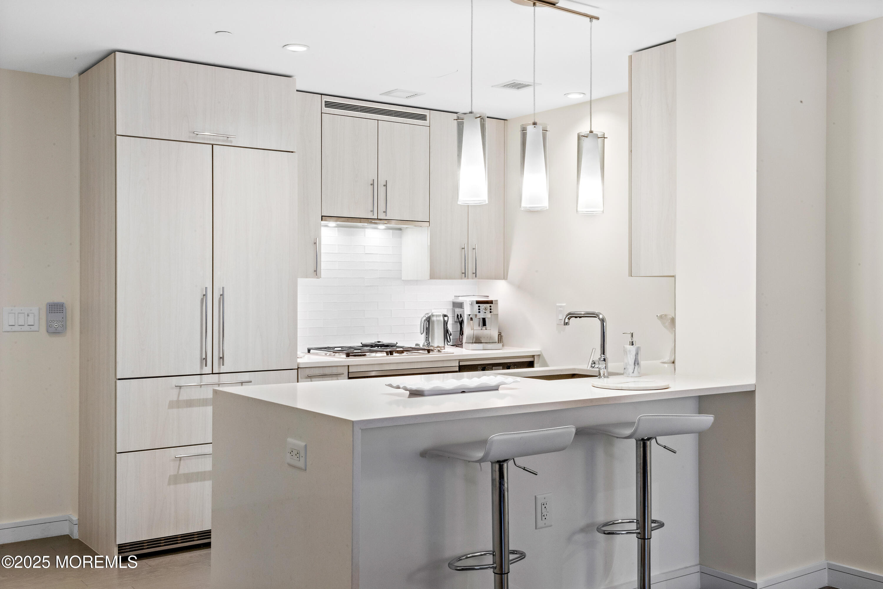 15 Morris Avenue, Unit 202 Long Branch, NJ 07740 - Photo 11 of 43 a kitchen with kitchen island a sink appliances and cabinets