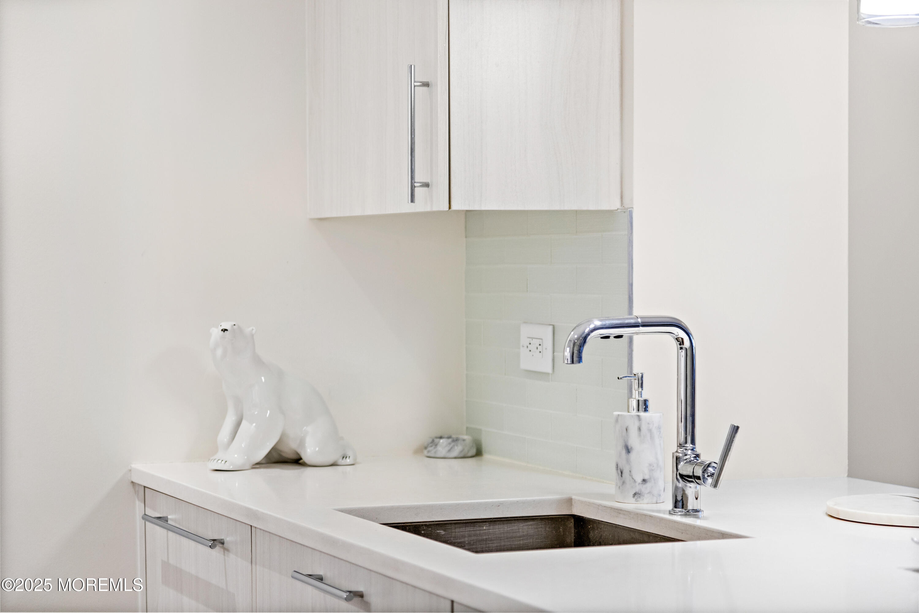 15 Morris Avenue, Unit 202 Long Branch, NJ 07740 - Photo 12 of 43 a bathroom with a sink and a mirror