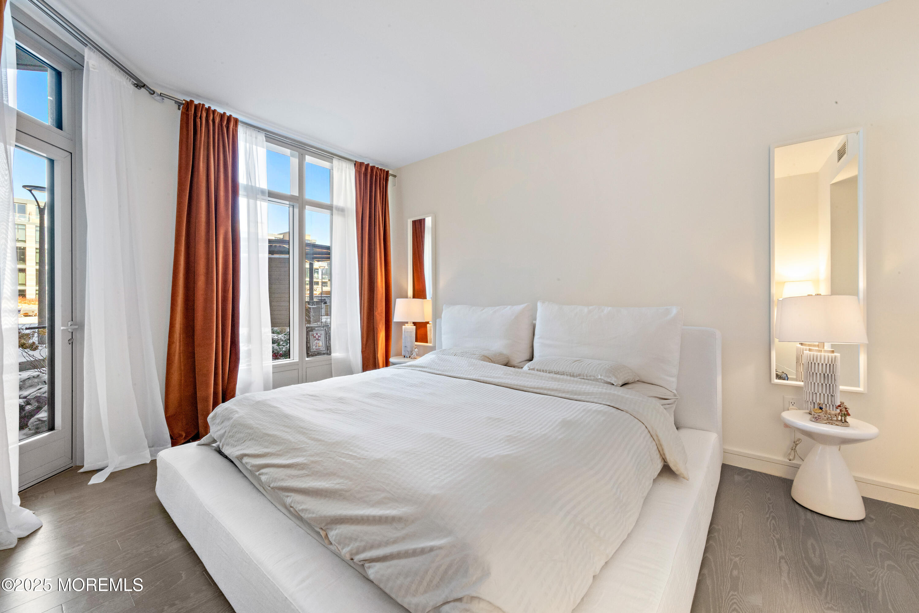 15 Morris Avenue, Unit 202 Long Branch, NJ 07740 - Photo 15 of 43 a bedroom with a bed and a large window