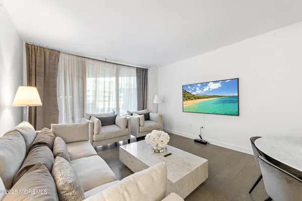 a living room with furniture and a lamp