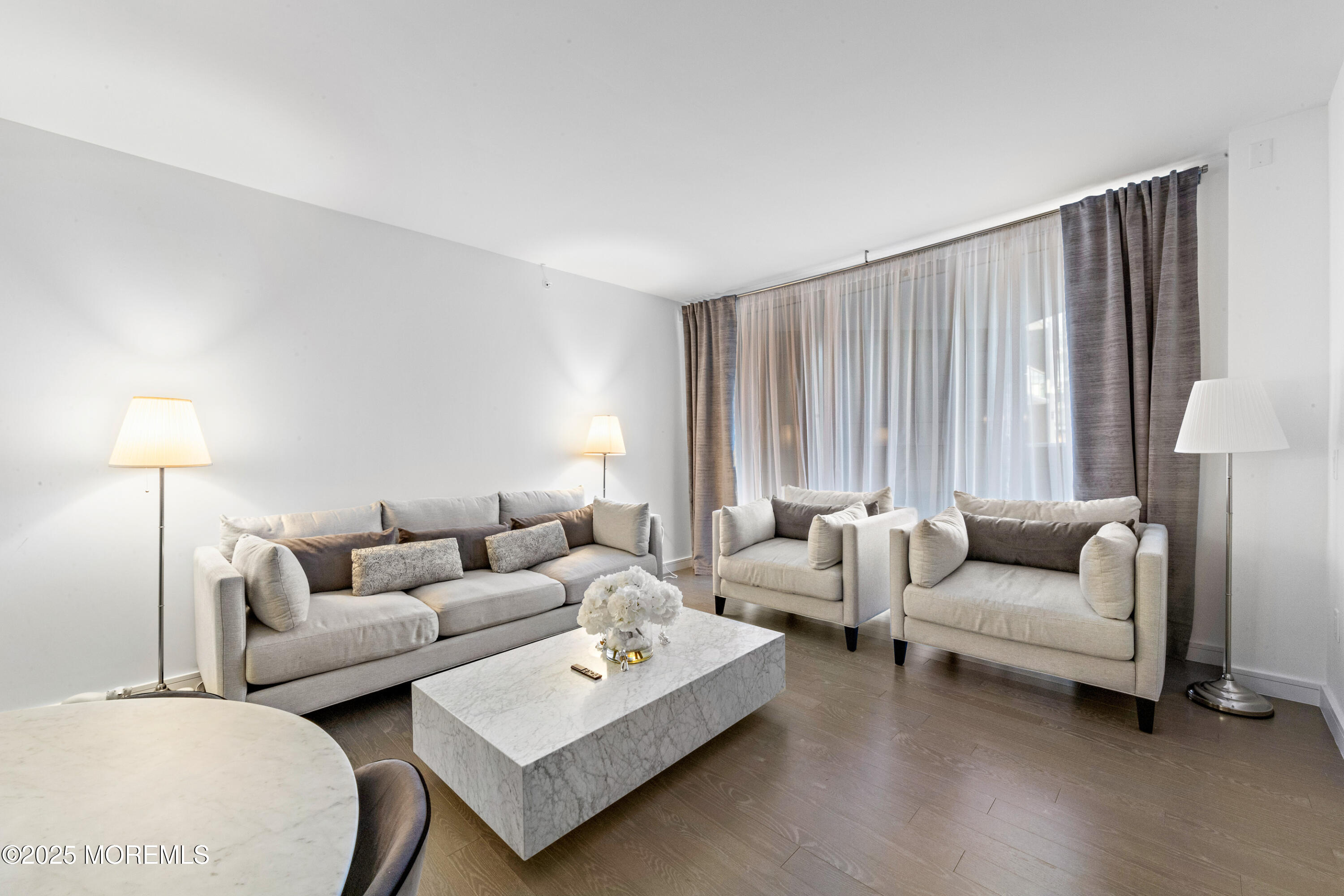 15 Morris Avenue, Unit 202 Long Branch, NJ 07740 - Photo 3 of 43 a living room with furniture and a lamp