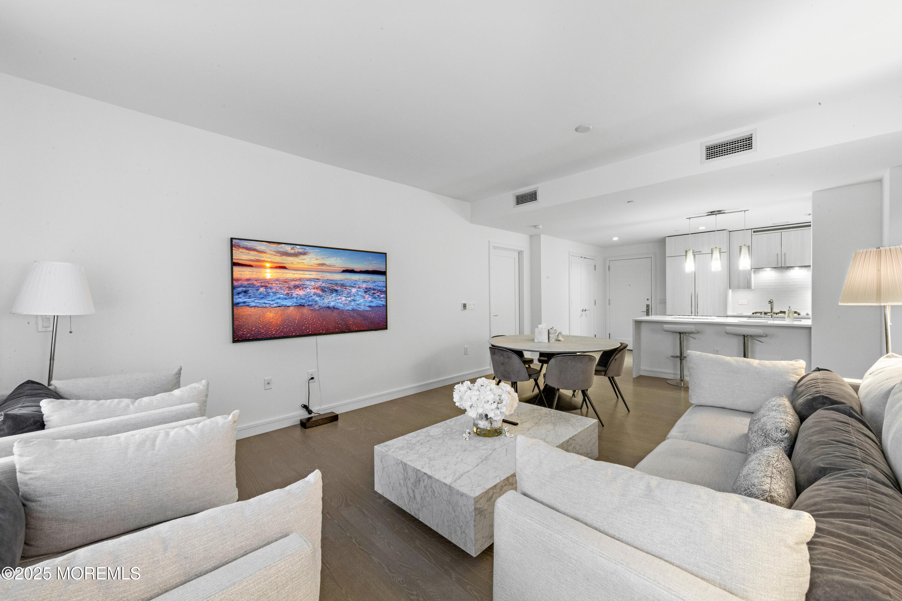 15 Morris Avenue, Unit 202 Long Branch, NJ 07740 - Photo 4 of 43 a living room with furniture and a flat screen tv