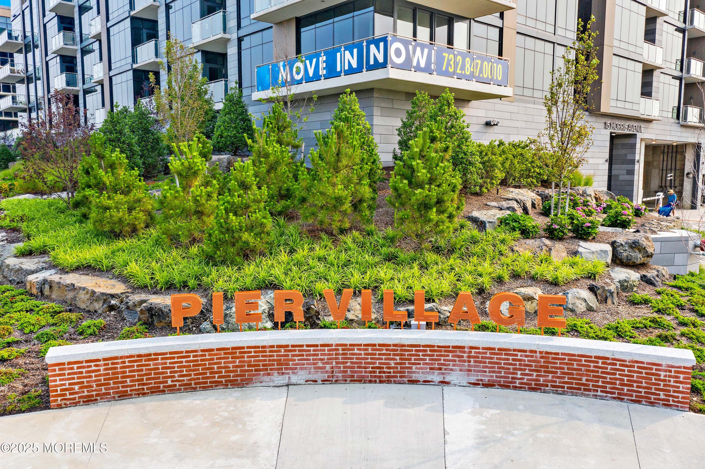 15 Morris Avenue, Unit 202 Long Branch, NJ 07740 - Photo 42 of 43 front view of a house with a yard and potted plants