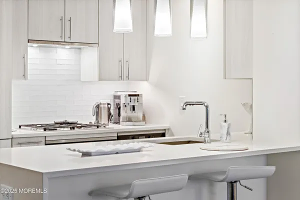 a spacious bedroom with a bed and a large mirror