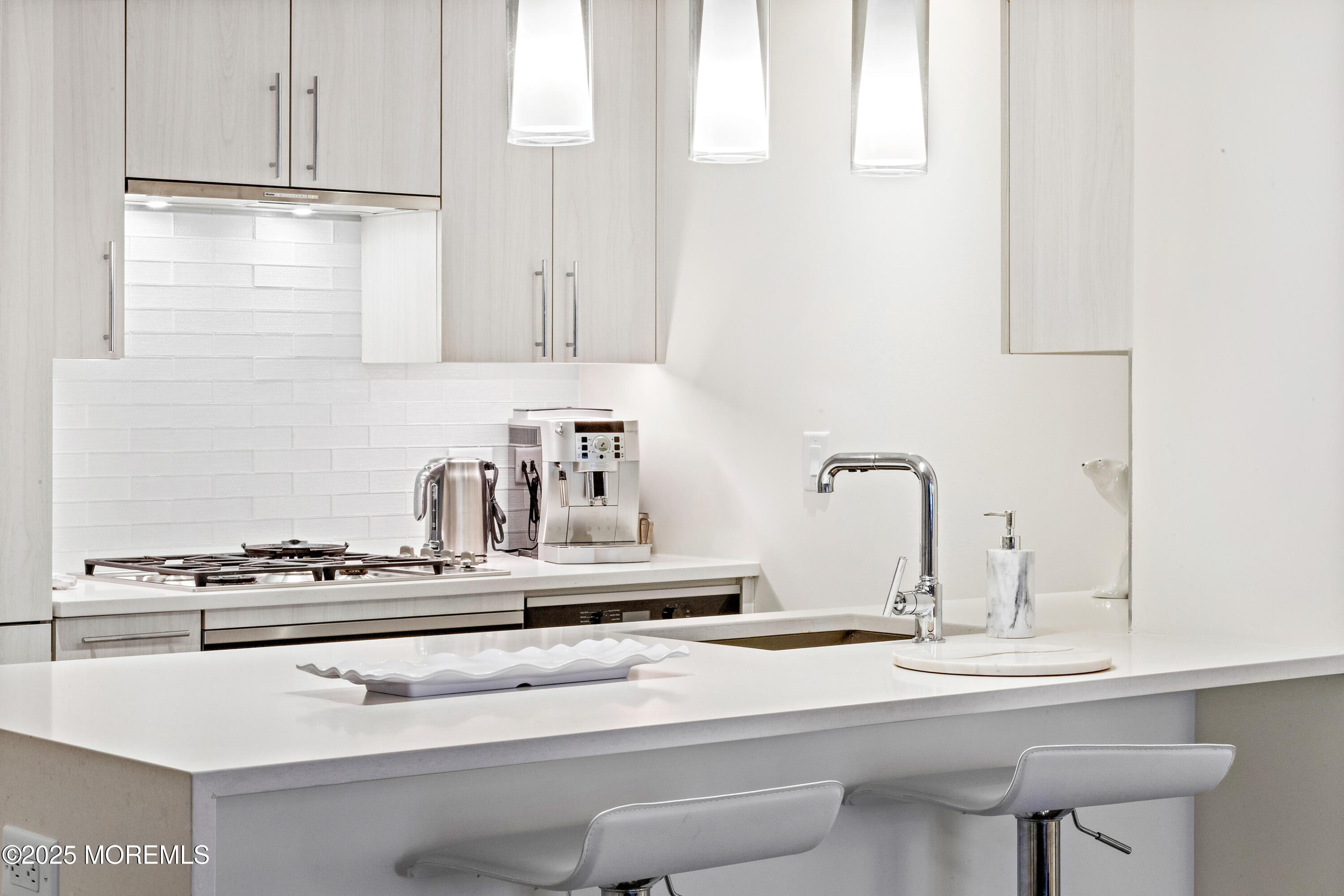 15 Morris Avenue, Unit 202 Long Branch, NJ 07740 - Photo 10 of 43 a kitchen with a sink and cabinets