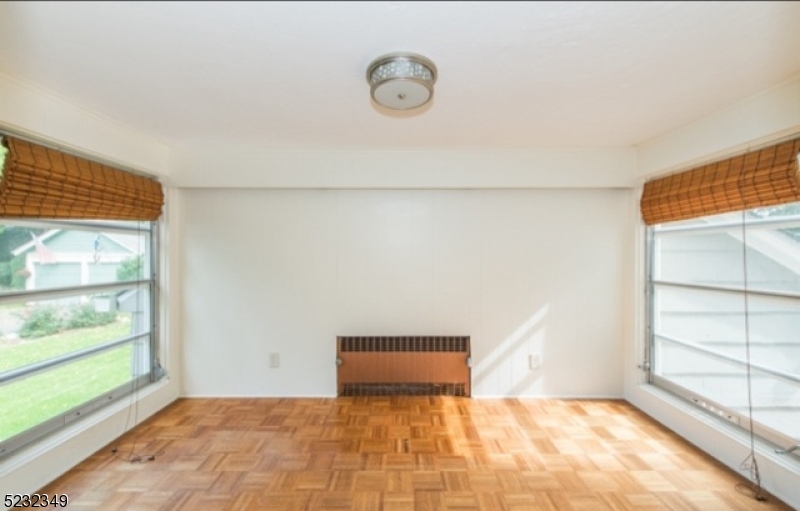 17 Bailey Road Millburn, NJ 07041 - Photo 13 of 24 a view of an empty room with a window