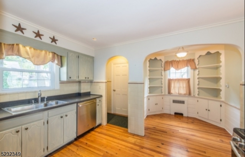 17 Bailey Road Millburn, NJ 07041 - Photo 9 of 24 a bathroom with a double vanity sink mirror and next to a window