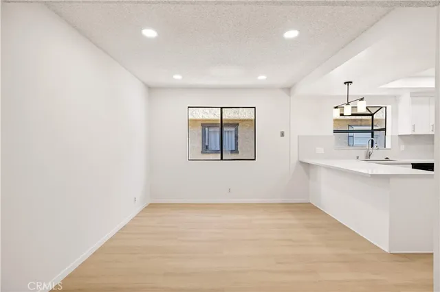 a view of kitchen with center island and wooden floor