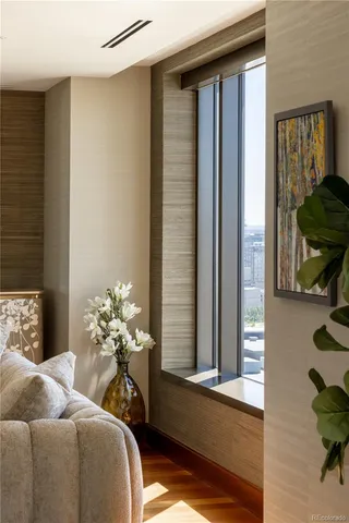 a bedroom with a bed and a chair