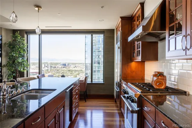 a kitchen with a large window and a sink