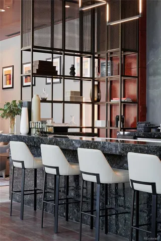 a view of a patio with couple of chairs and a fire pit