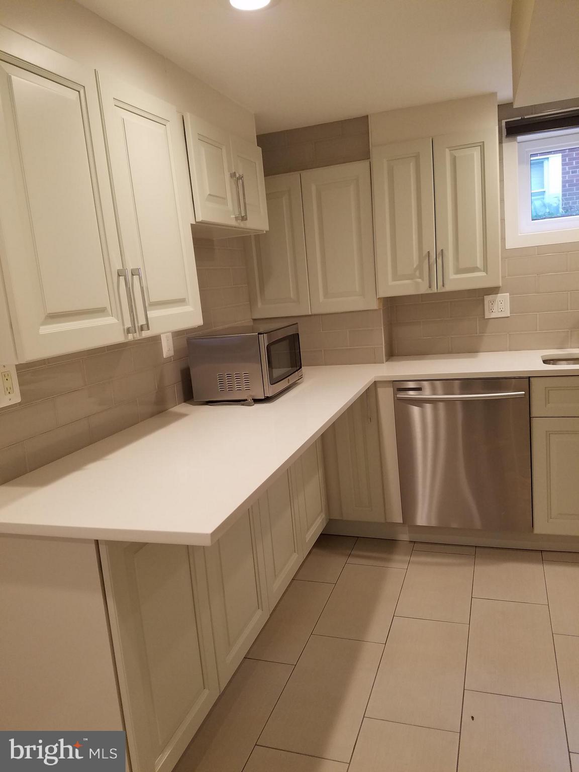 12919 Neola Road Silver Spring, MD 20906 - Photo 21 of 29 Lower level kitchen view from living room