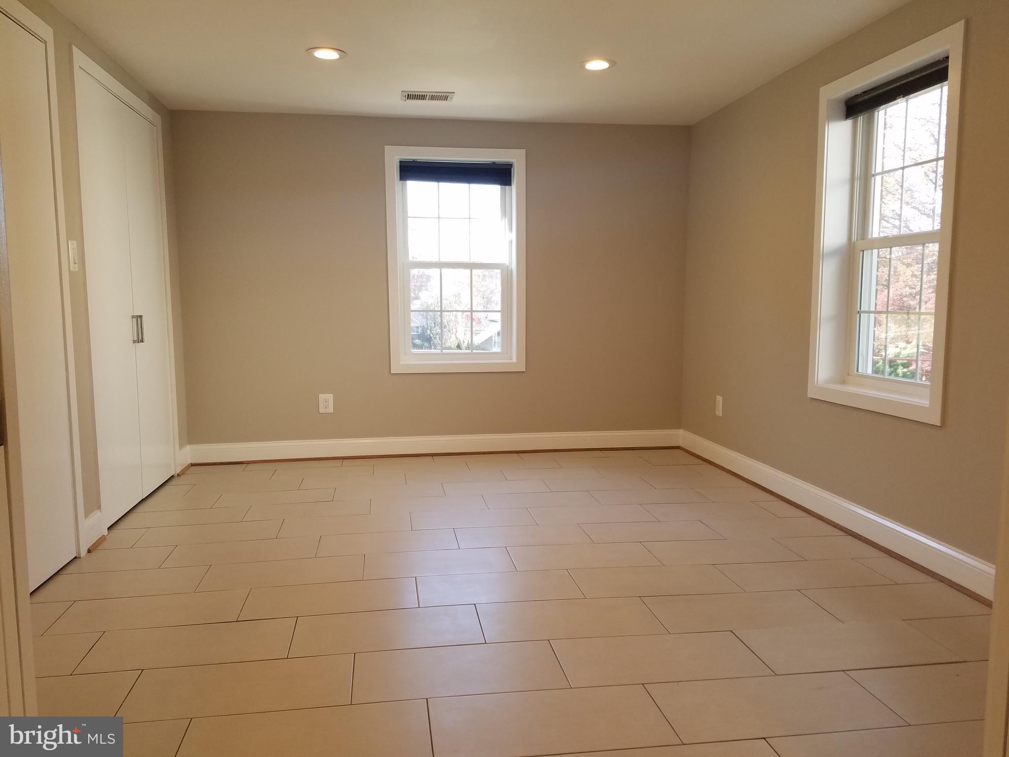 12919 Neola Road Silver Spring, MD 20906 - Photo 24 of 29 Bedroom on lower level with retractable doors
