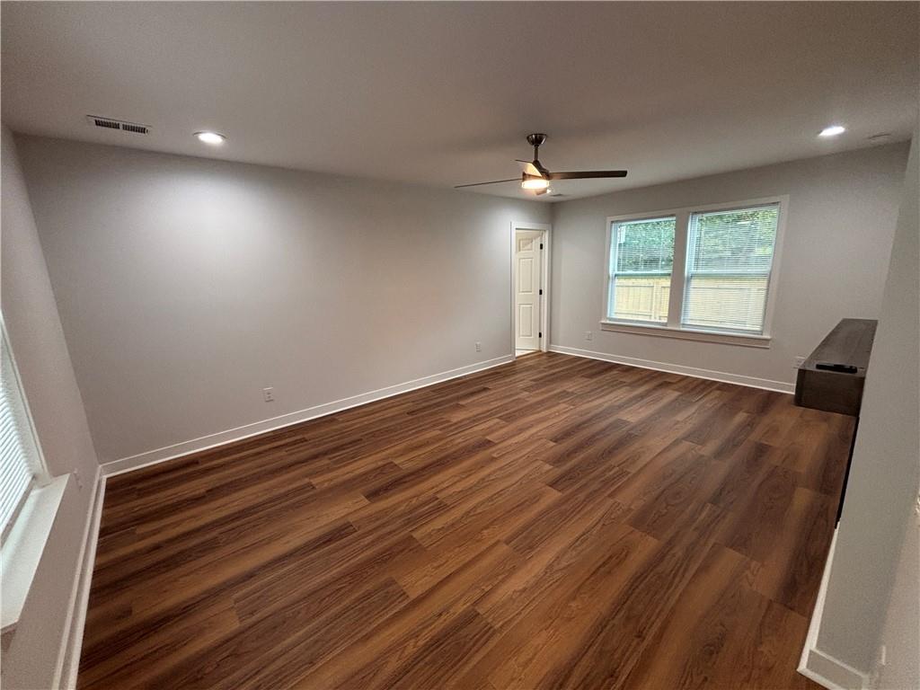 1389 Lanvale Drive Southwest Atlanta, GA 30310 - Photo 11 of 27 wooden floor in an empty room with a window