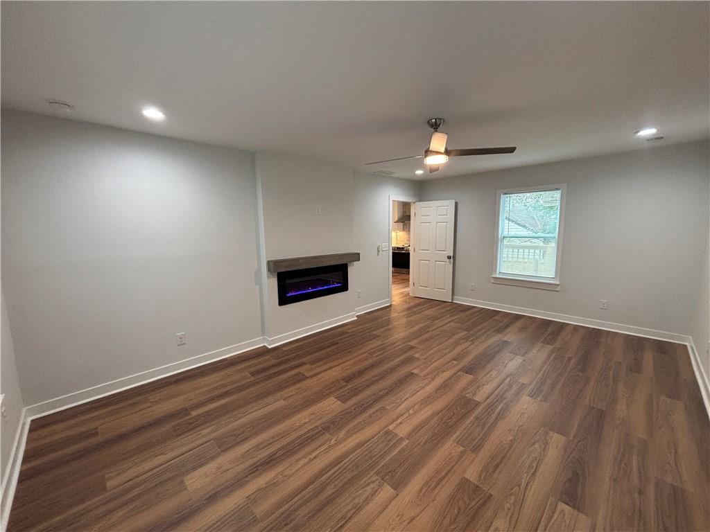1389 Lanvale Drive Southwest Atlanta, GA 30310 - Photo 12 of 27 an empty room with windows and ceiling fan