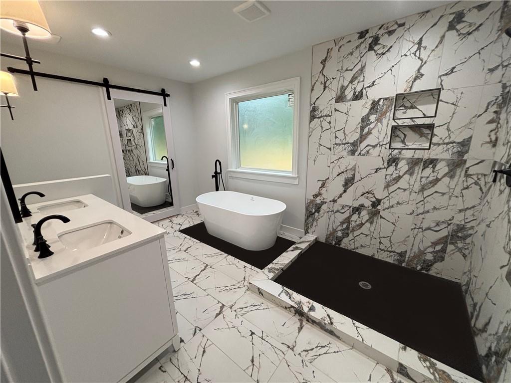 1389 Lanvale Drive Southwest Atlanta, GA 30310 - Photo 13 of 27 a bathroom with a toilet sink and mirror