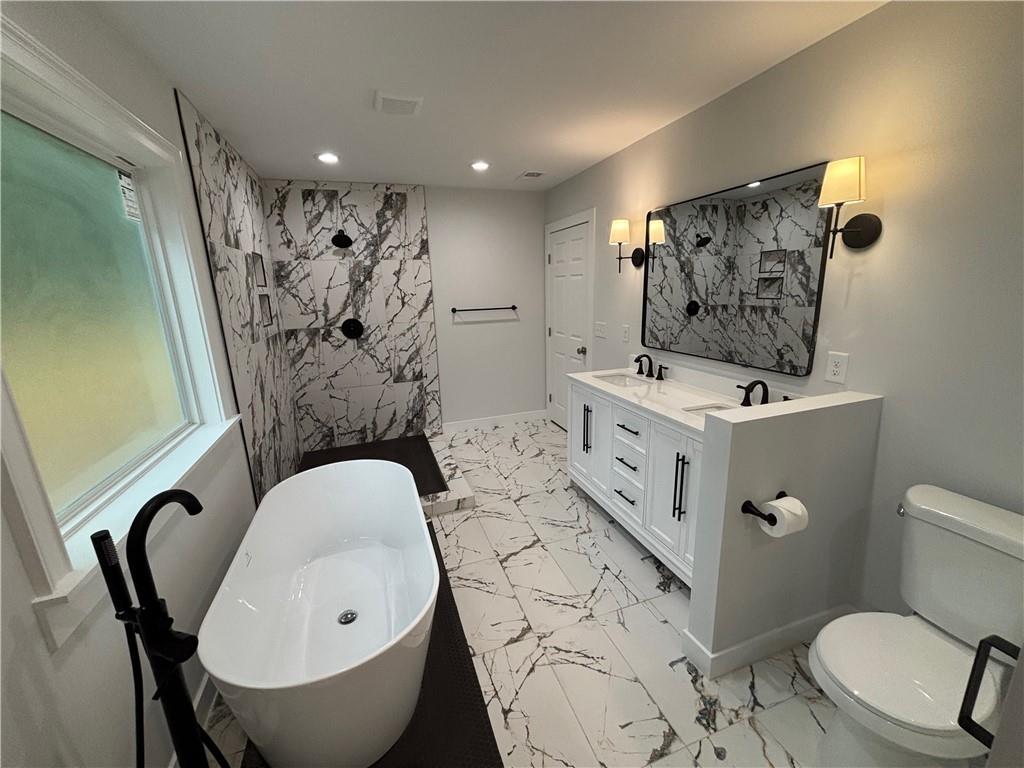 1389 Lanvale Drive Southwest Atlanta, GA 30310 - Photo 14 of 27 a bathroom with a sink toilet and shower