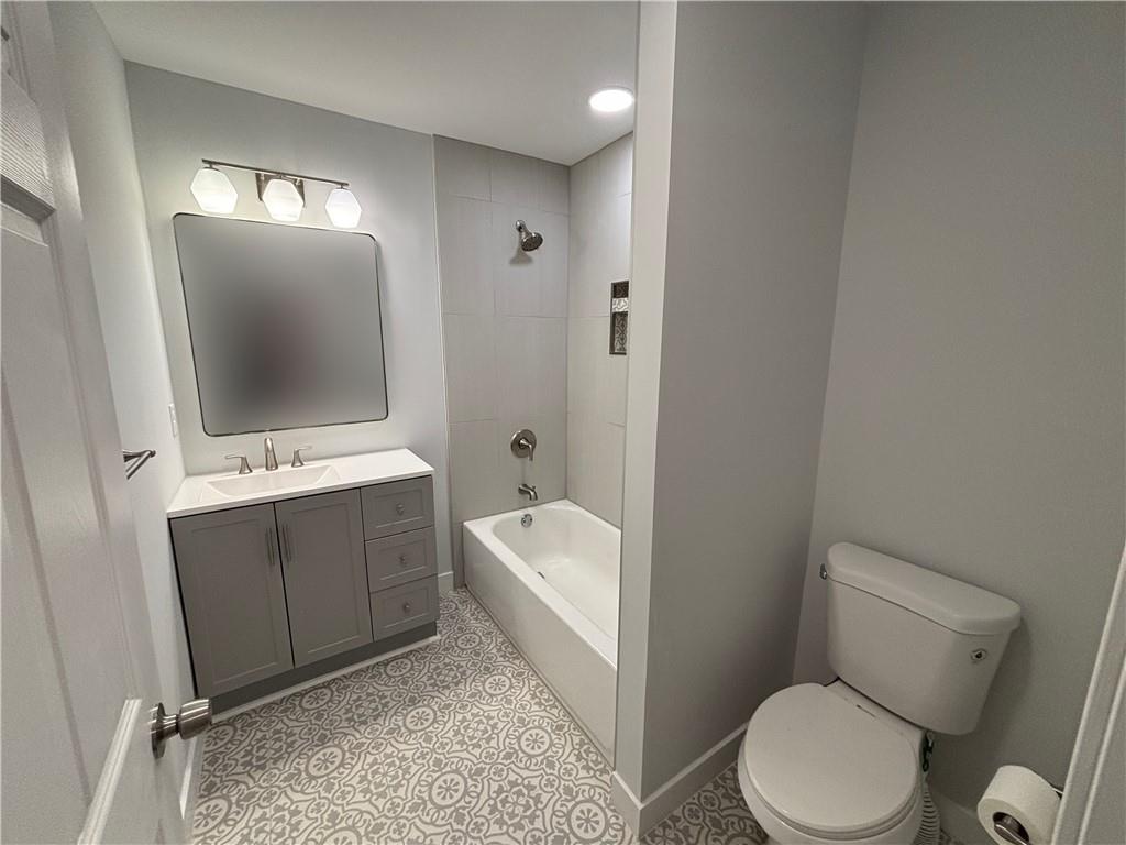 1389 Lanvale Drive Southwest Atlanta, GA 30310 - Photo 16 of 27 a bathroom with a sink a toilet and mirror