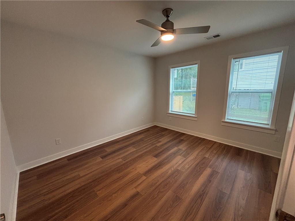 1389 Lanvale Drive Southwest Atlanta, GA 30310 - Photo 20 of 27 wooden floor in an empty room with a window
