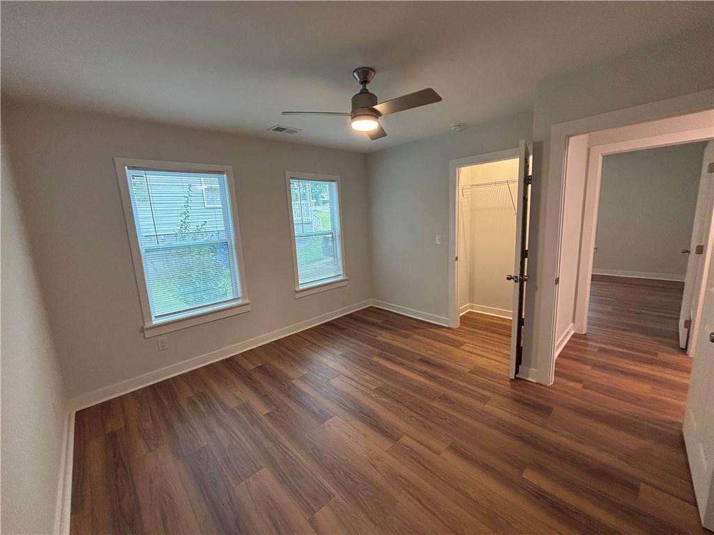 1389 Lanvale Drive Southwest Atlanta, GA 30310 - Photo 21 of 27 a view of an empty room with wooden floor and a window
