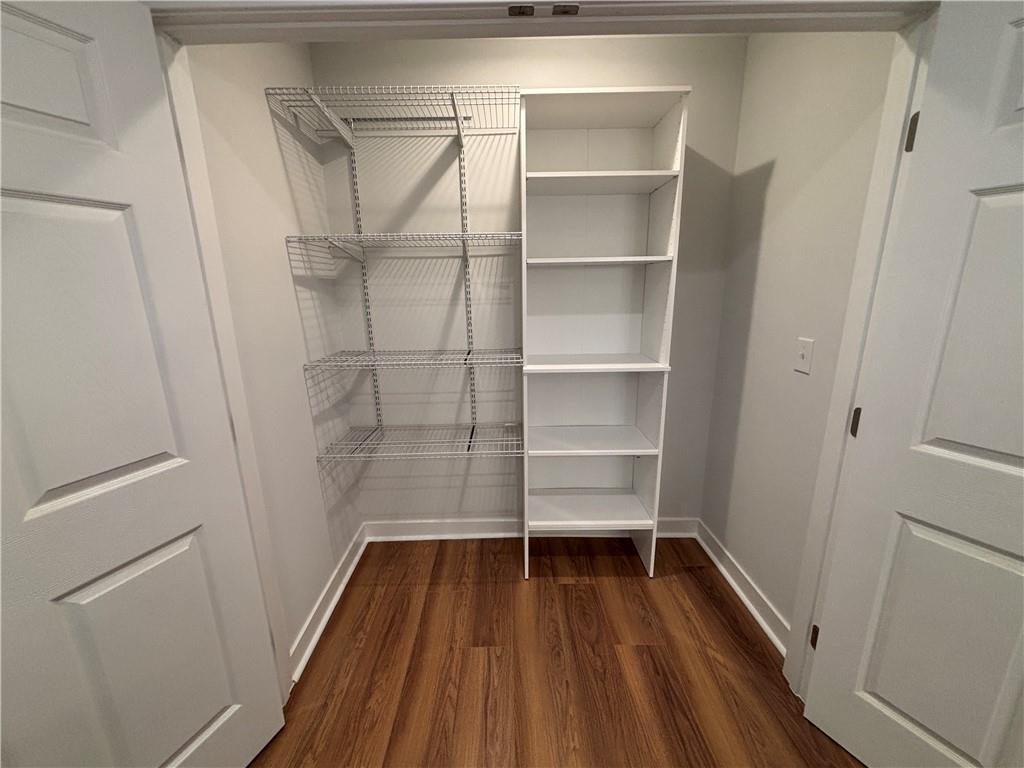 1389 Lanvale Drive Southwest Atlanta, GA 30310 - Photo 22 of 27 a view of walk in closet with empty racks
