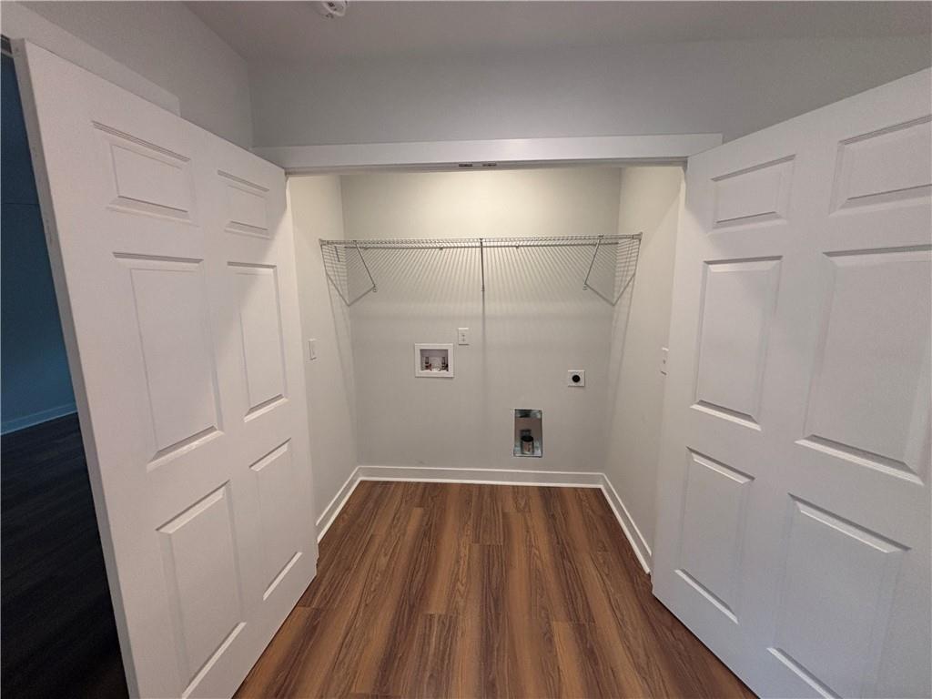 1389 Lanvale Drive Southwest Atlanta, GA 30310 - Photo 23 of 27 a view of a room with wooden floor and white walls