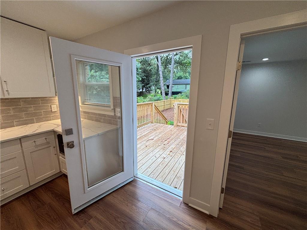 1389 Lanvale Drive Southwest Atlanta, GA 30310 - Photo 10 of 27 a view of a hallway with wooden floor and cabinet