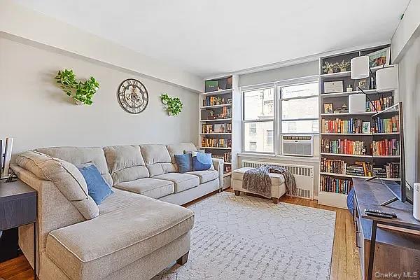 800 Grand Bronx, NY 10451 - Photo 1 of 10 a living room with furniture and a book shelf