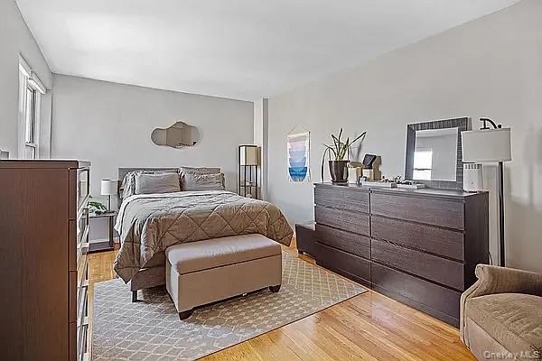 800 Grand Bronx, NY 10451 - Photo 7 of 10 a bedroom with a bed and wooden floor
