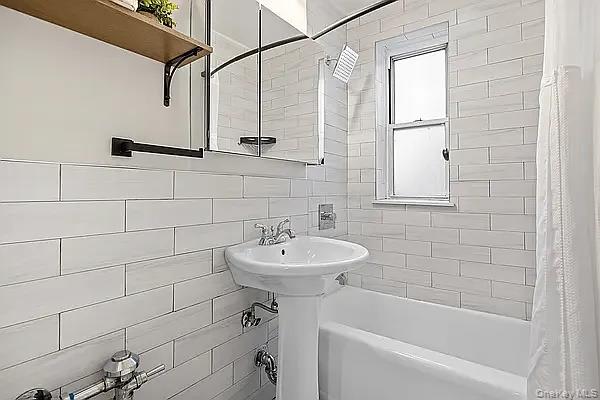 800 Grand Bronx, NY 10451 - Photo 9 of 10 a bathroom with a sink a toilet and shower