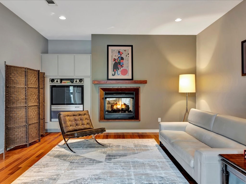 3418 St George Circle Nacogdoches, TX 75965 - Photo 11 of 50 a living room with furniture a rug and a fireplace